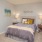 a bedroom with a bed and lamps