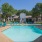 a swimming pool with chairs around it