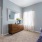 Large well lit bedroom with plush carpets and large windows 