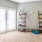 Large well lit bedroom with plush carpets and large windows 