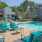 a pool with chairs around it