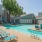 a swimming pool with chairs around it