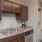 a kitchen with wooden cabinets